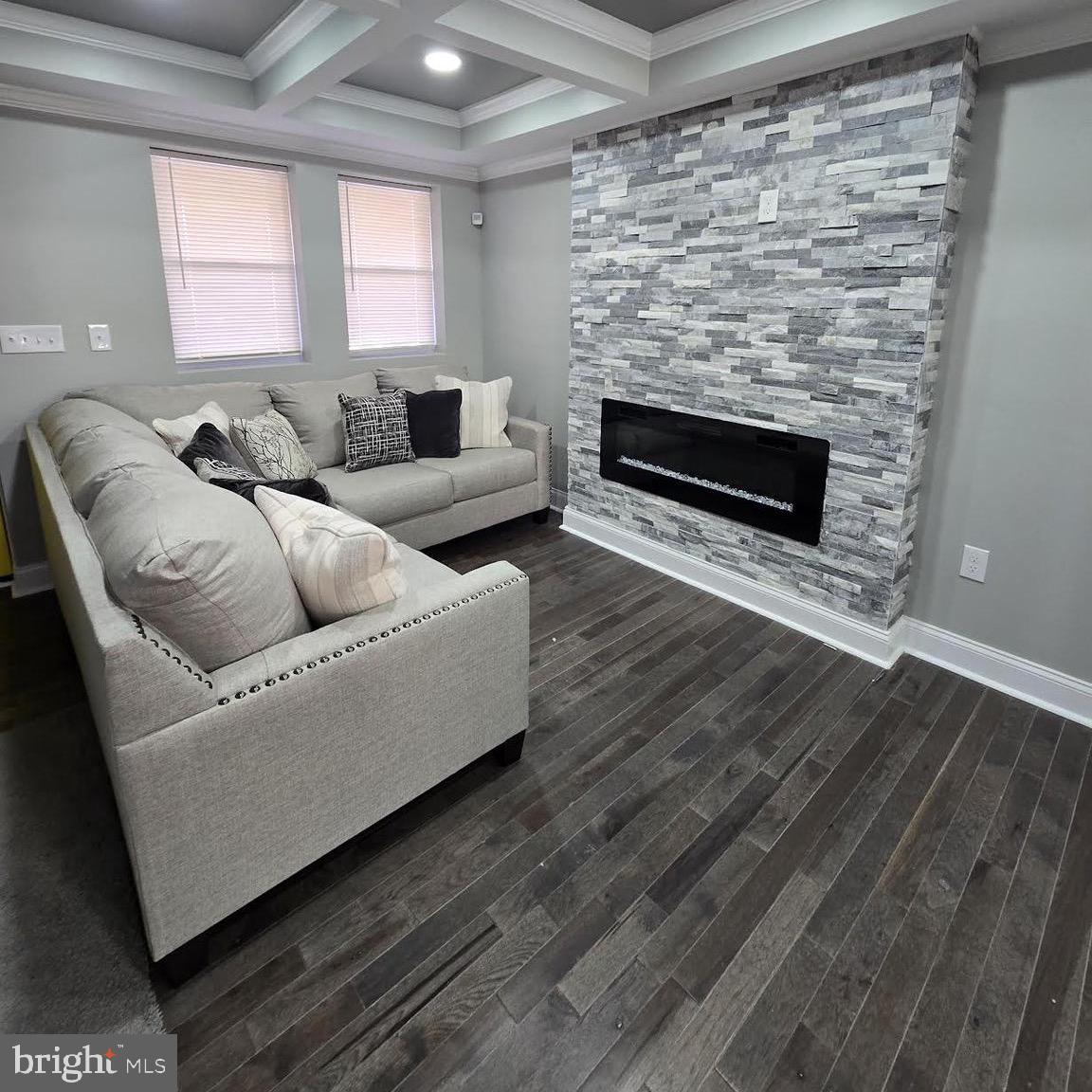4139 Mountwood Road Baltimore, MD 21229 - Photo 29 of 53 a living room with furniture and a fireplace
