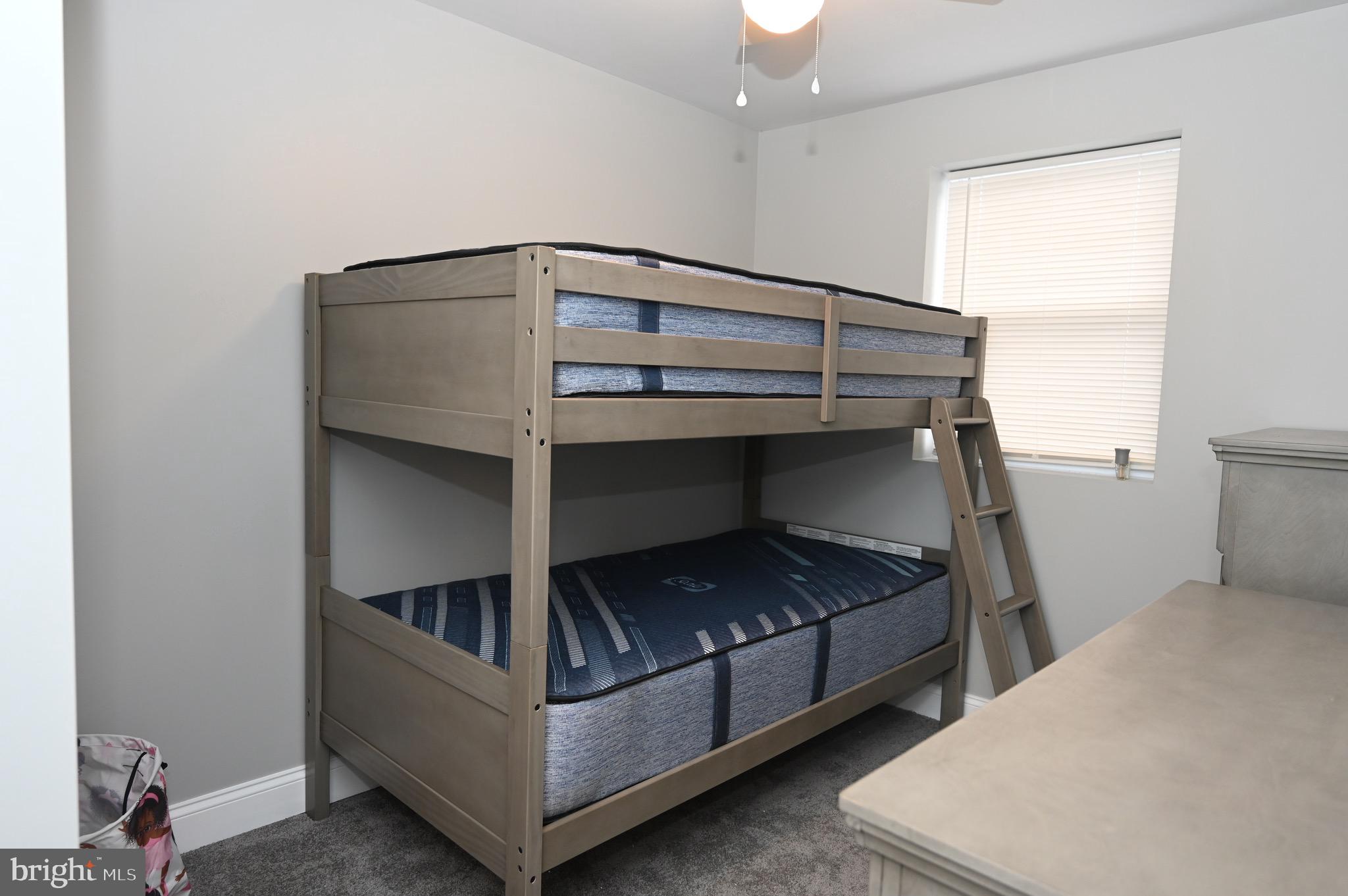 4139 Mountwood Road Baltimore, MD 21229 - Photo 30 of 53 a bedroom with a bunk bed and a window