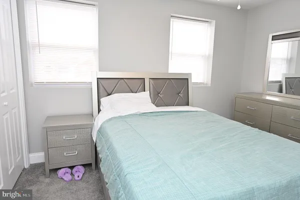 a bedroom with a bed and a view of bathroom