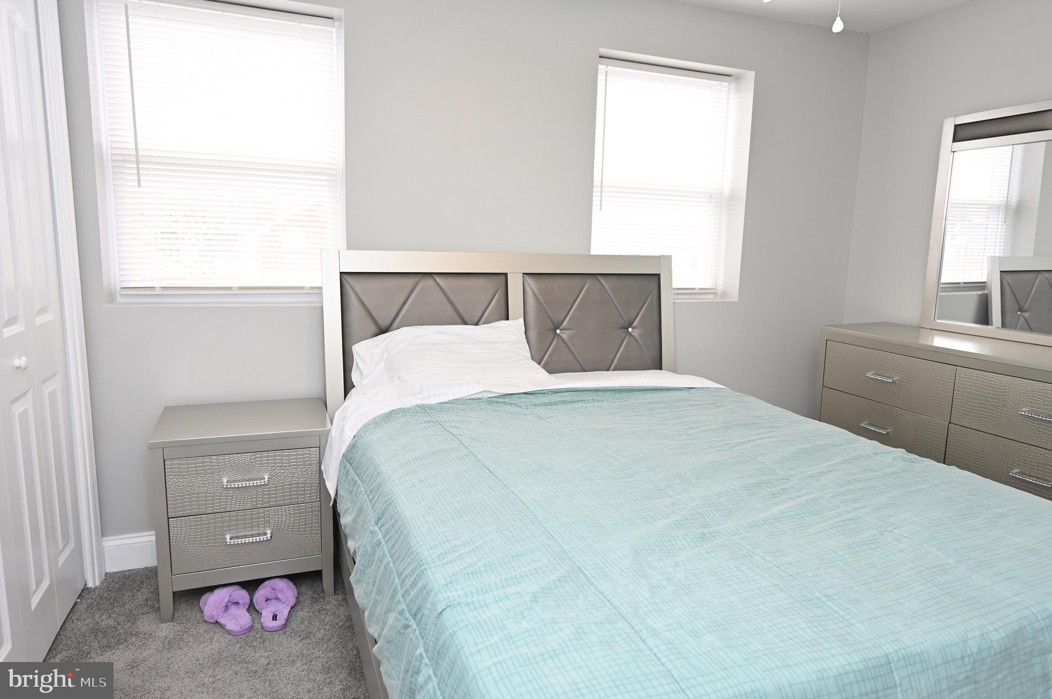 4139 Mountwood Road Baltimore, MD 21229 - Photo 36 of 53 a bedroom with a bed and a window