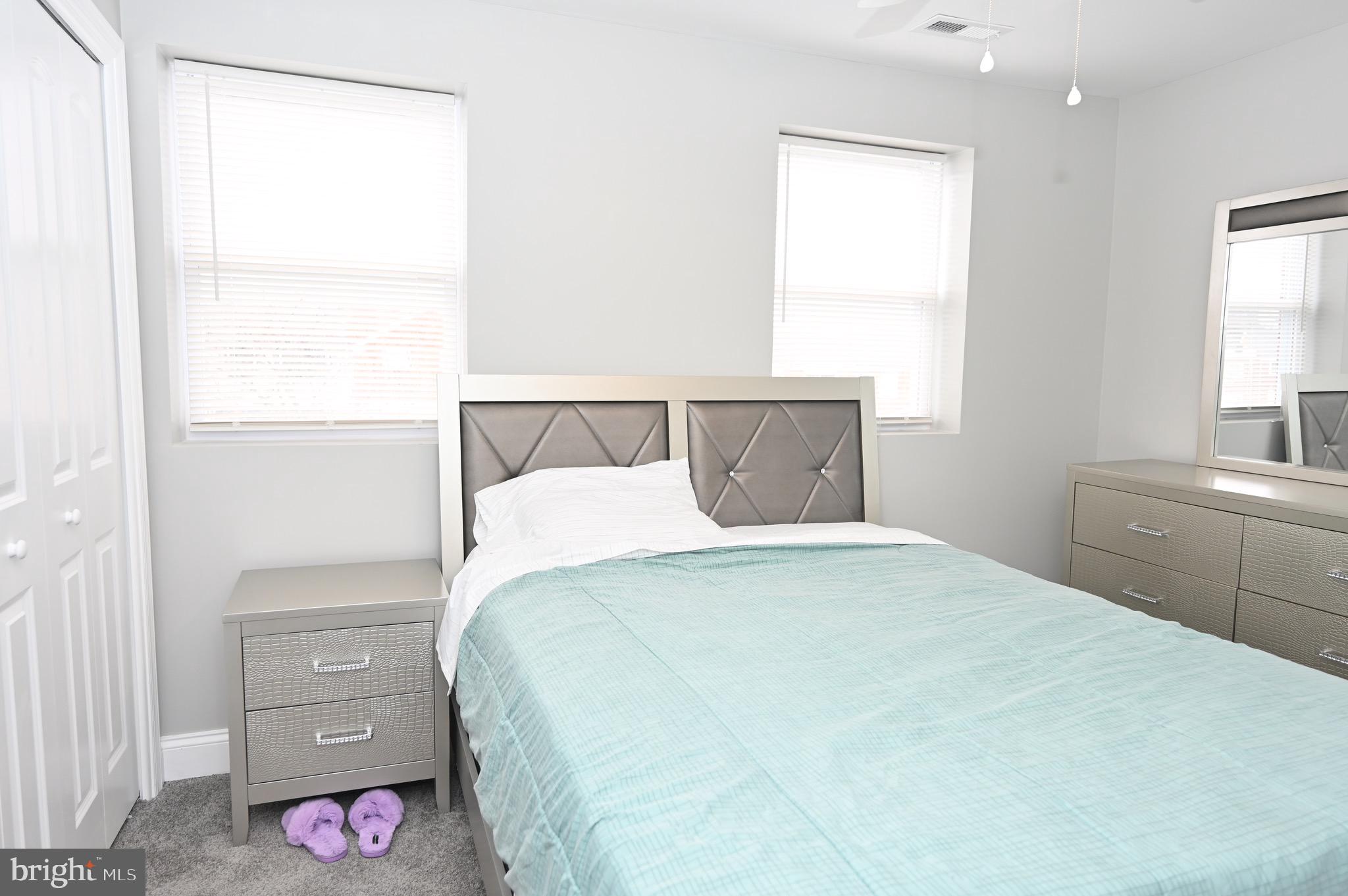 4139 Mountwood Road Baltimore, MD 21229 - Photo 38 of 53 a bedroom with a bed and a view of bathroom