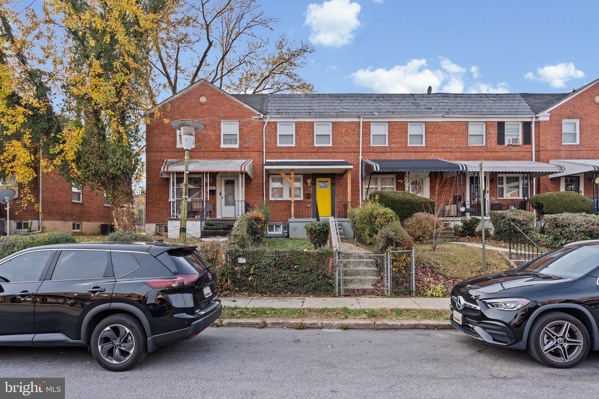 4139 Mountwood Road Baltimore, MD 21229 - Photo 49 of 53 a car parked in front of a house