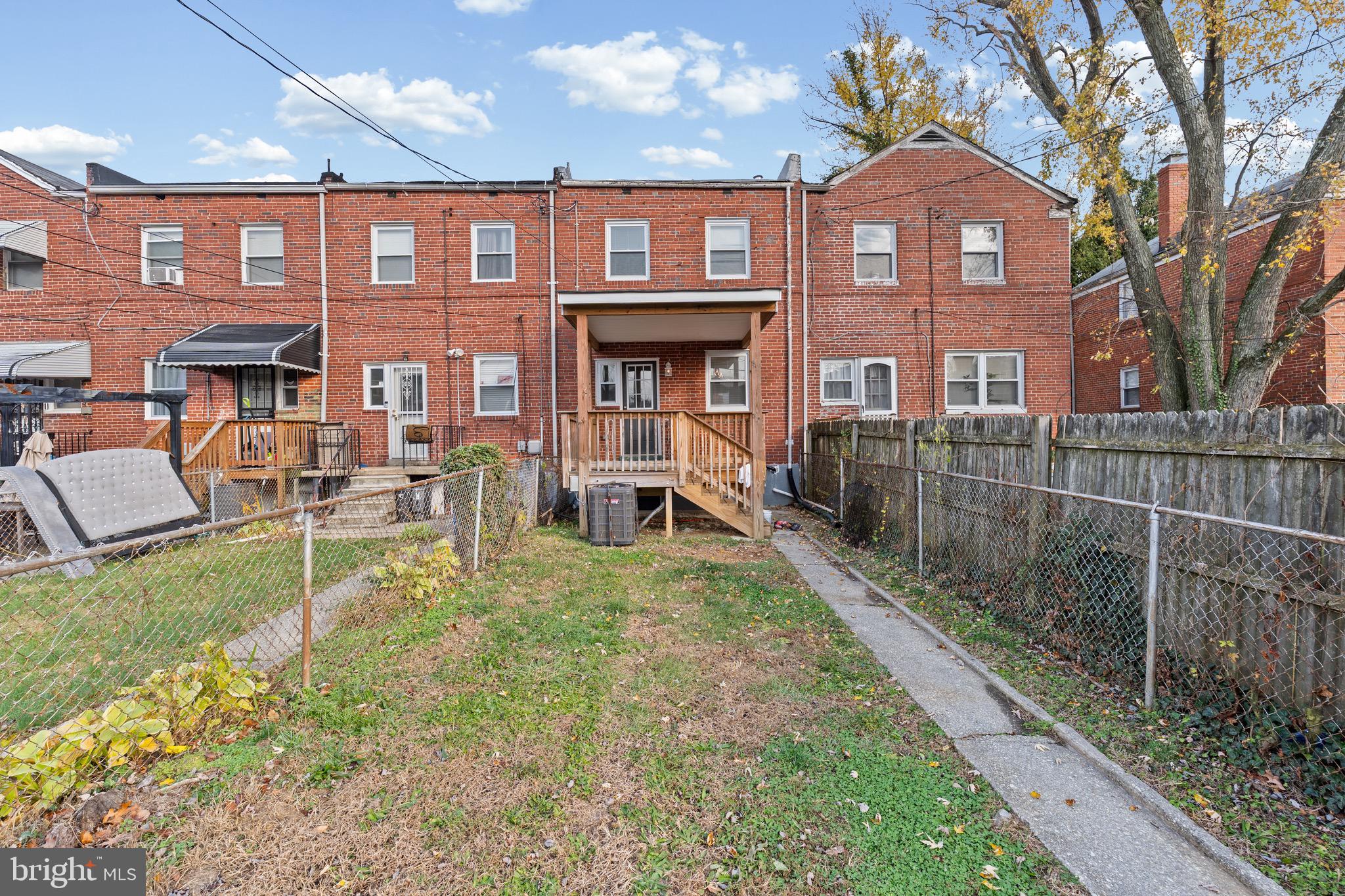 4139 Mountwood Road Baltimore, MD 21229 - Photo 51 of 53 a front view of a house with a yard