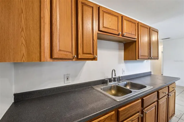 a kitchen with a sink and cabinets