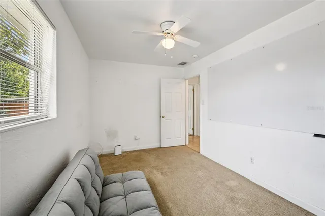 a living room with a bed