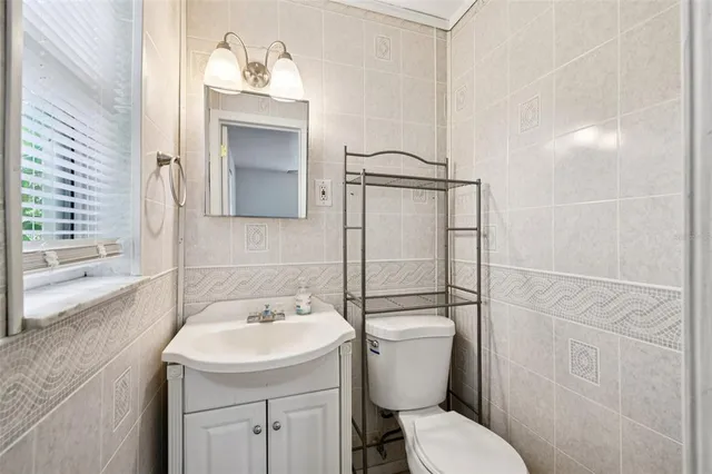a bathroom with a toilet sink and shower