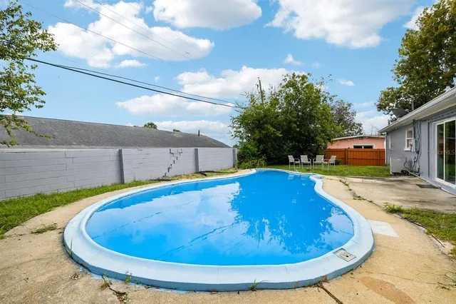 a view of outdoor space and swimming pool