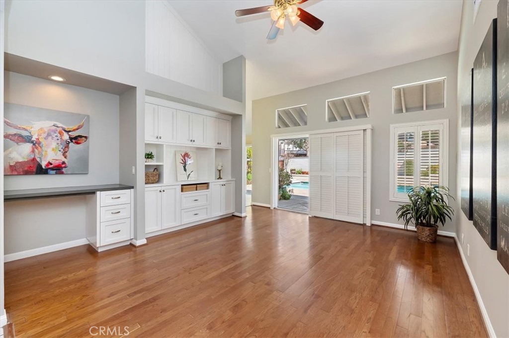 43966 Highlander Drive Temecula, CA 92592 - Photo 12 of 33 a view of an empty room with a window and wooden floor