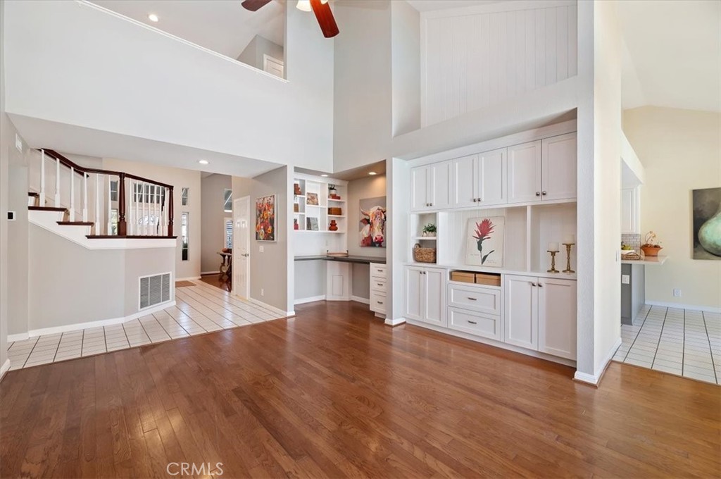 43966 Highlander Drive Temecula, CA 92592 - Photo 13 of 33 a large kitchen with cabinets wooden floor and stainless steel appliances