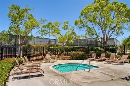 43966 Highlander Drive Temecula, CA 92592 - Photo 30 of 33 a swimming pool with outdoor seating and trees