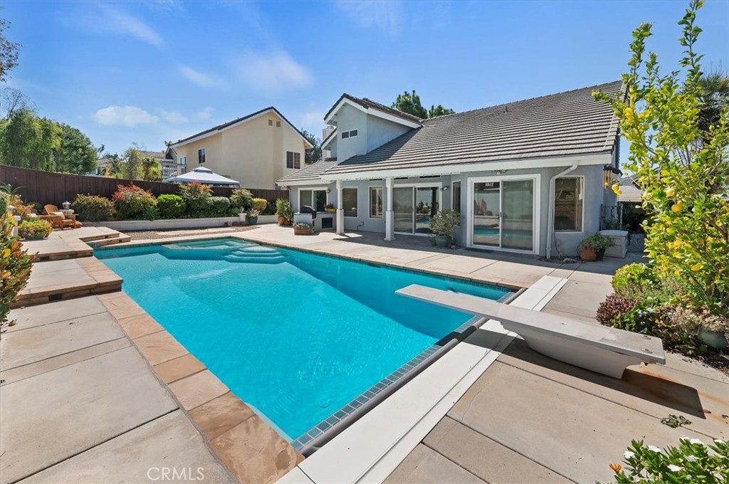 43966 Highlander Drive Temecula, CA 92592 - Photo 4 of 33 a view of a house with swimming pool and a yard
