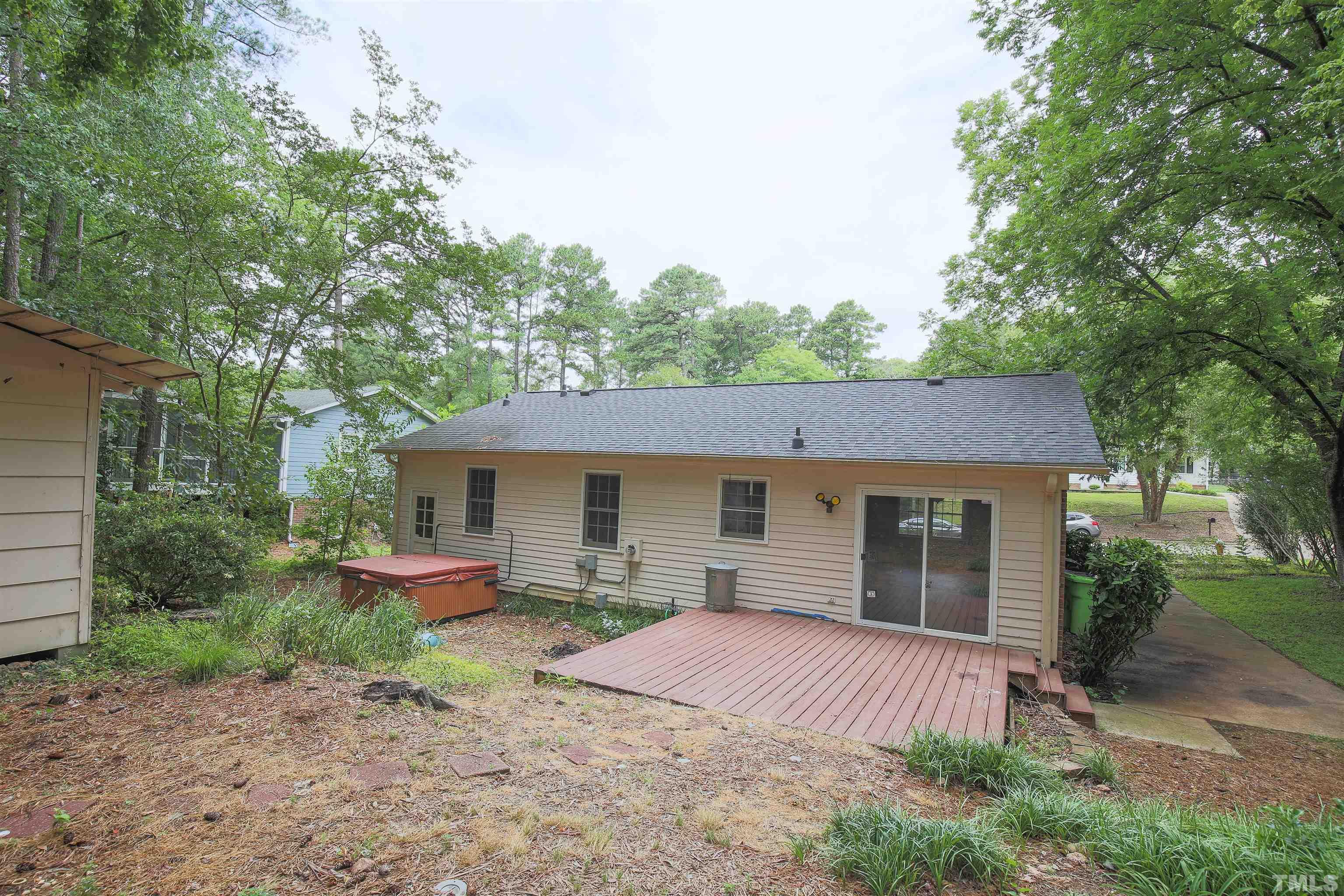 7712 Cart Track Trail Raleigh, NC 27615 - Photo 11 of 11 a front view of a house with garden