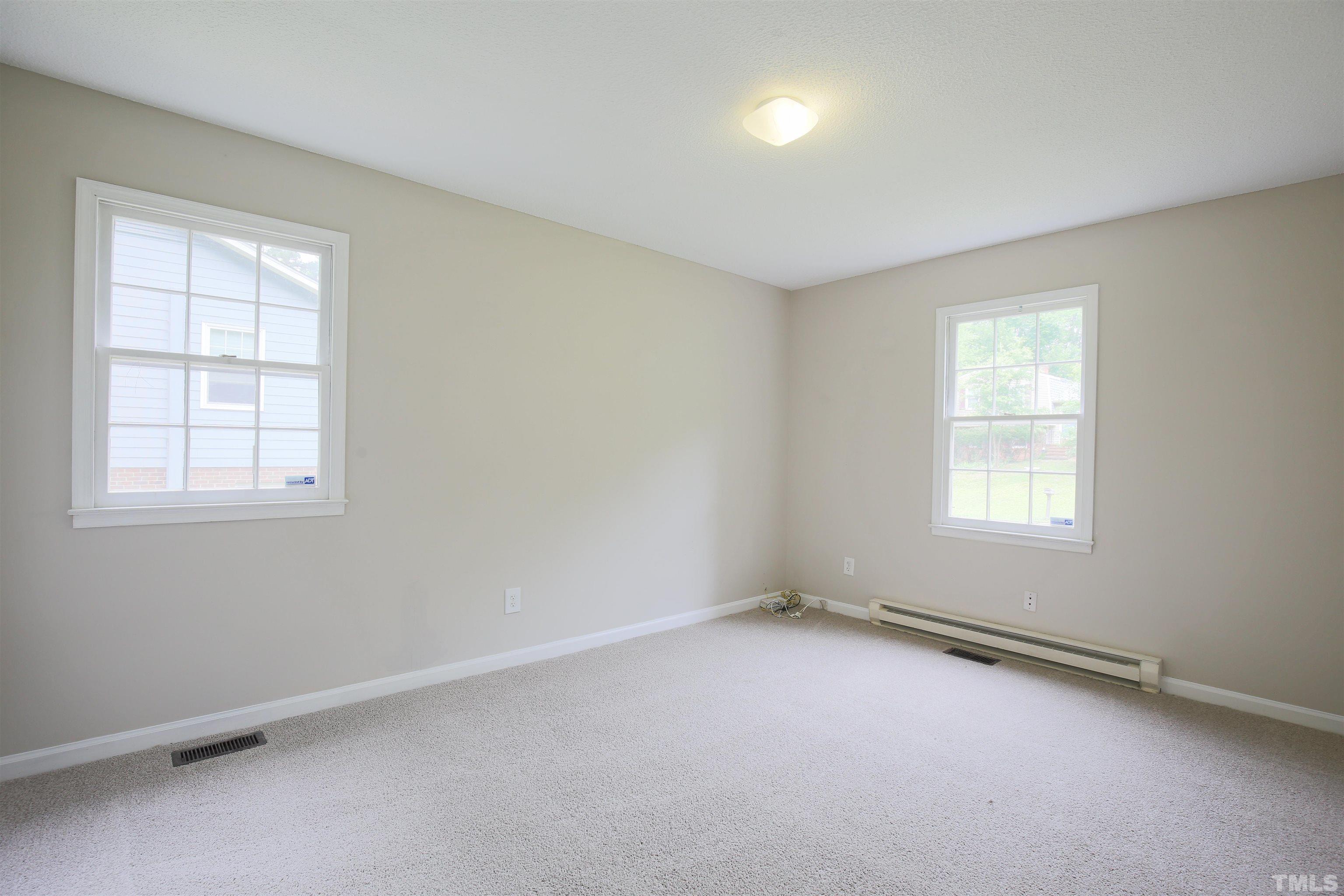 7712 Cart Track Trail Raleigh, NC 27615 - Photo 8 of 11 an empty room with a window