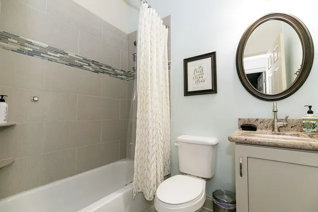 a bathroom with a toilet a sink and a bathtub
