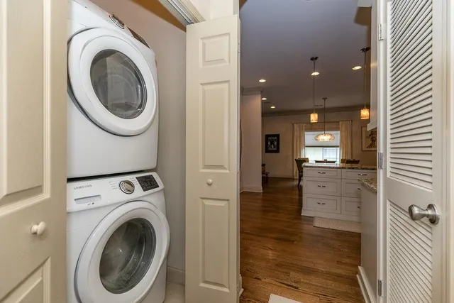 a view of a hallway with washer and dryer