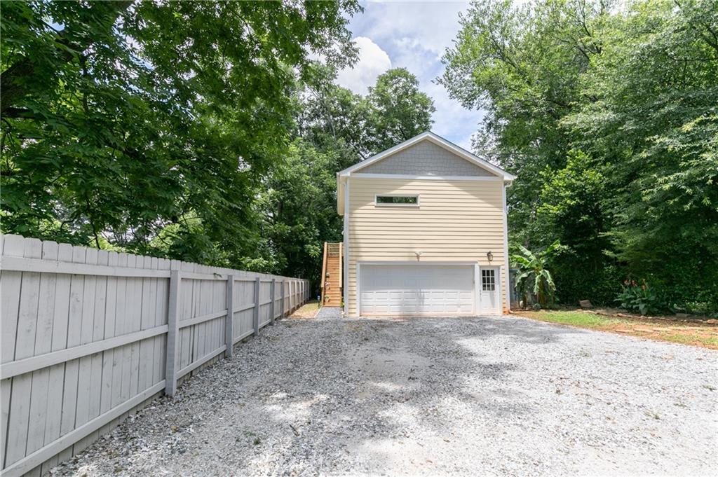 1084 Sanders Avenue Southeast, Unit A Atlanta, GA 30316 - Photo 44 of 44 a front view of a house with a yard and garage