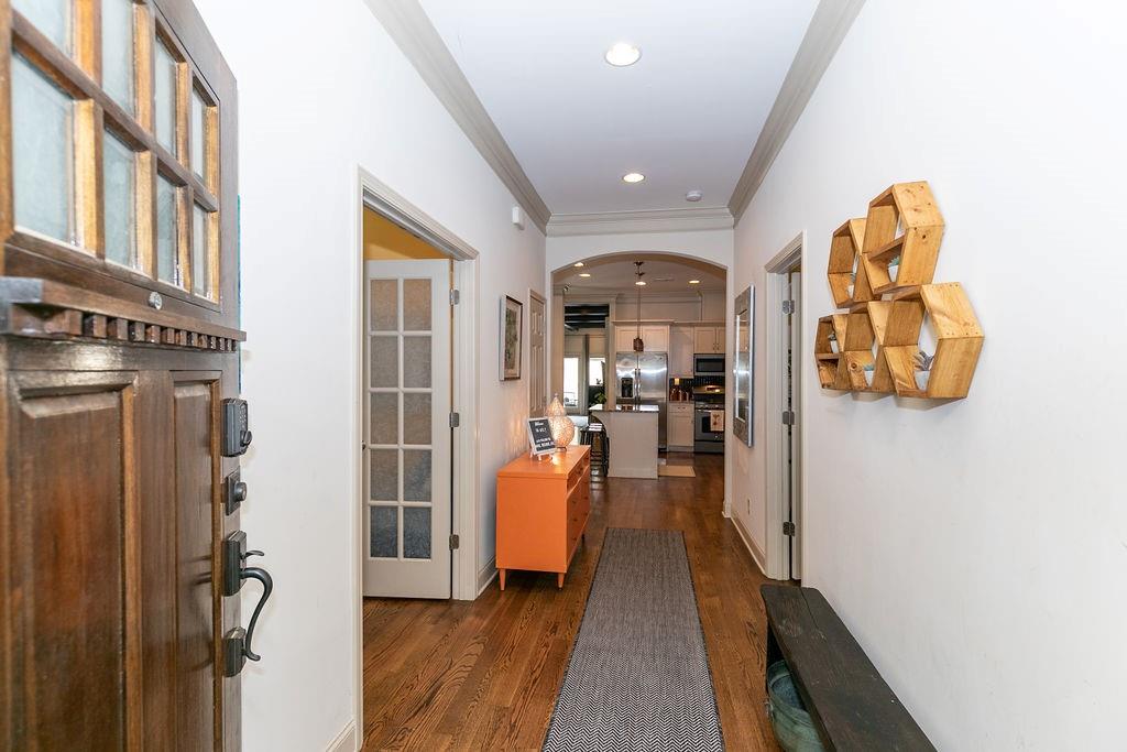 1084 Sanders Avenue Southeast, Unit A Atlanta, GA 30316 - Photo 5 of 44 a view of a hallway with wooden floor and furniture