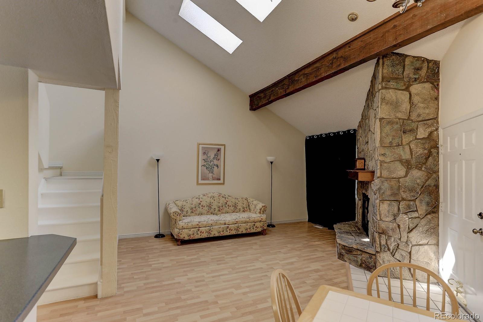8794 Allison Drive, Unit B Arvada, CO 80005 - Photo 12 of 33 a living room with furniture