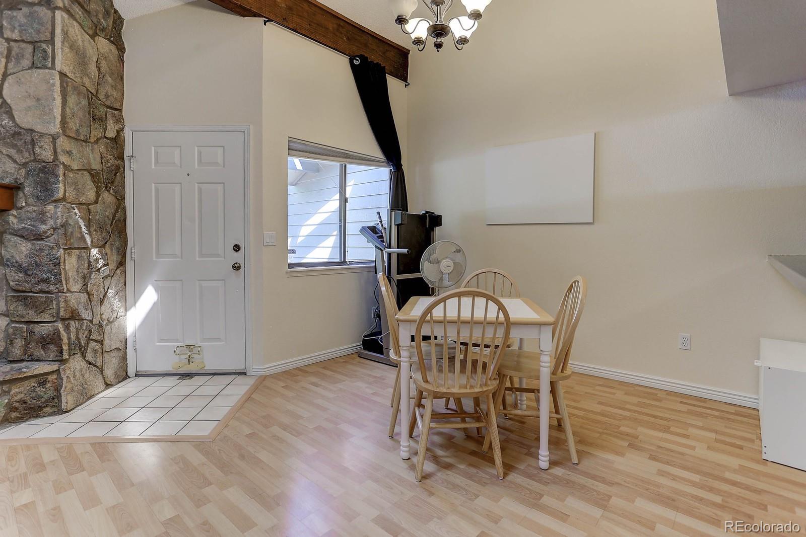 8794 Allison Drive, Unit B Arvada, CO 80005 - Photo 2 of 33 a view of a dining room with furniture and wooden floor