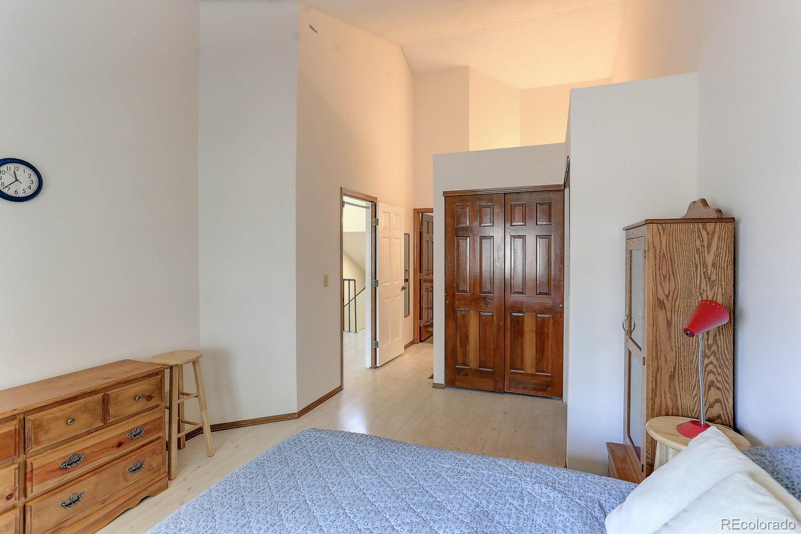 8794 Allison Drive, Unit B Arvada, CO 80005 - Photo 21 of 33 a view of an entryway with wooden floor and cabinet