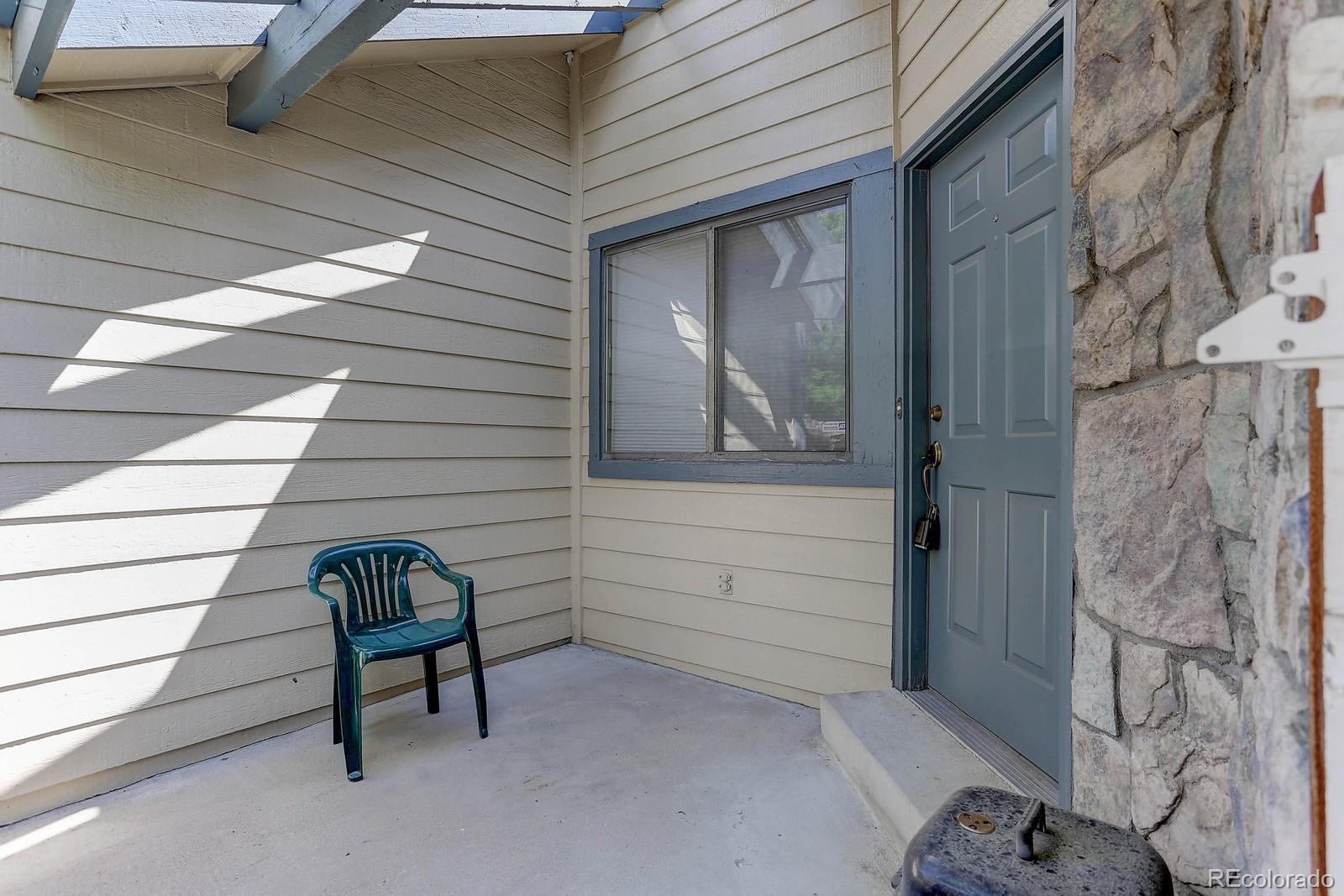 8794 Allison Drive, Unit B Arvada, CO 80005 - Photo 27 of 33 a view of wooden bench in a door