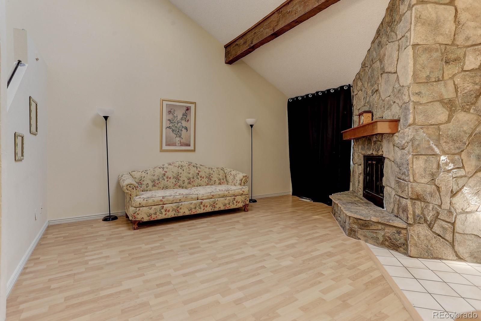 8794 Allison Drive, Unit B Arvada, CO 80005 - Photo 3 of 33 a bedroom with a bed and a walk in closet