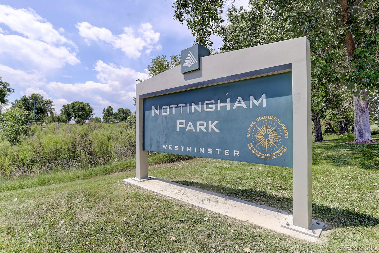 8794 Allison Drive, Unit B Arvada, CO 80005 - Photo 33 of 33 a sign that is on the side of a building