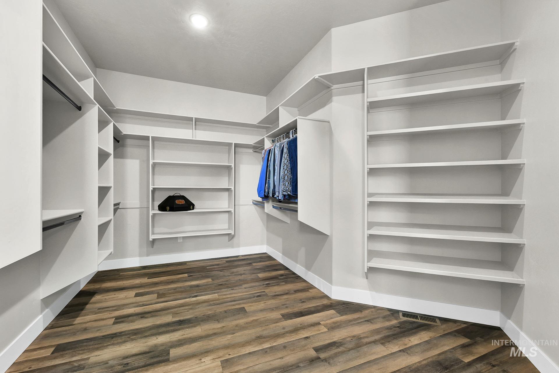 27114 Lower Pleasant Ridge Road Wilder, ID 83676 - Photo 18 of 50 Walk in closet with dark wood-style flooring