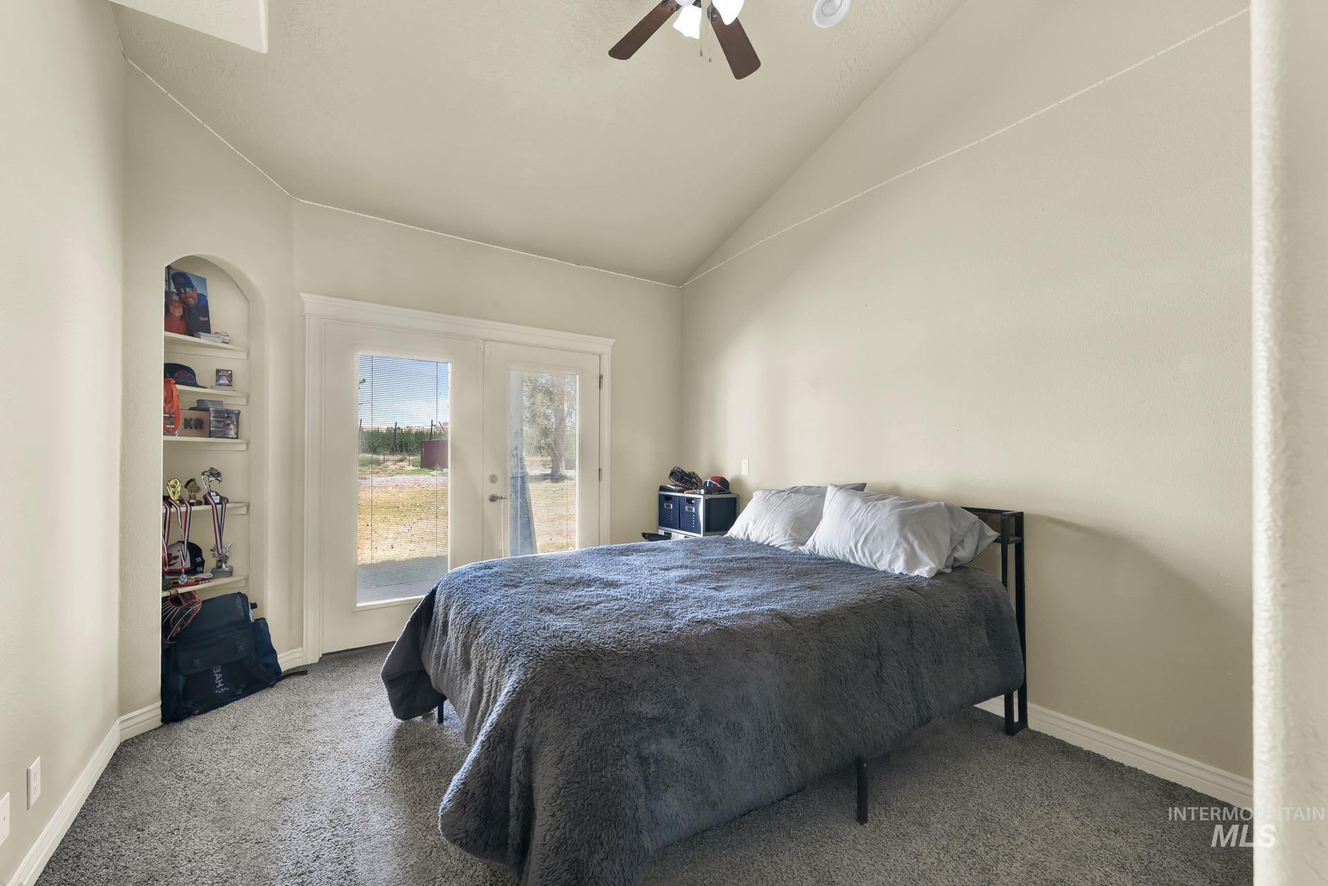 27114 Lower Pleasant Ridge Road Wilder, ID 83676 - Photo 41 of 50 Bedroom with access to outside, vaulted ceiling, carpet, french doors, and ceiling fan