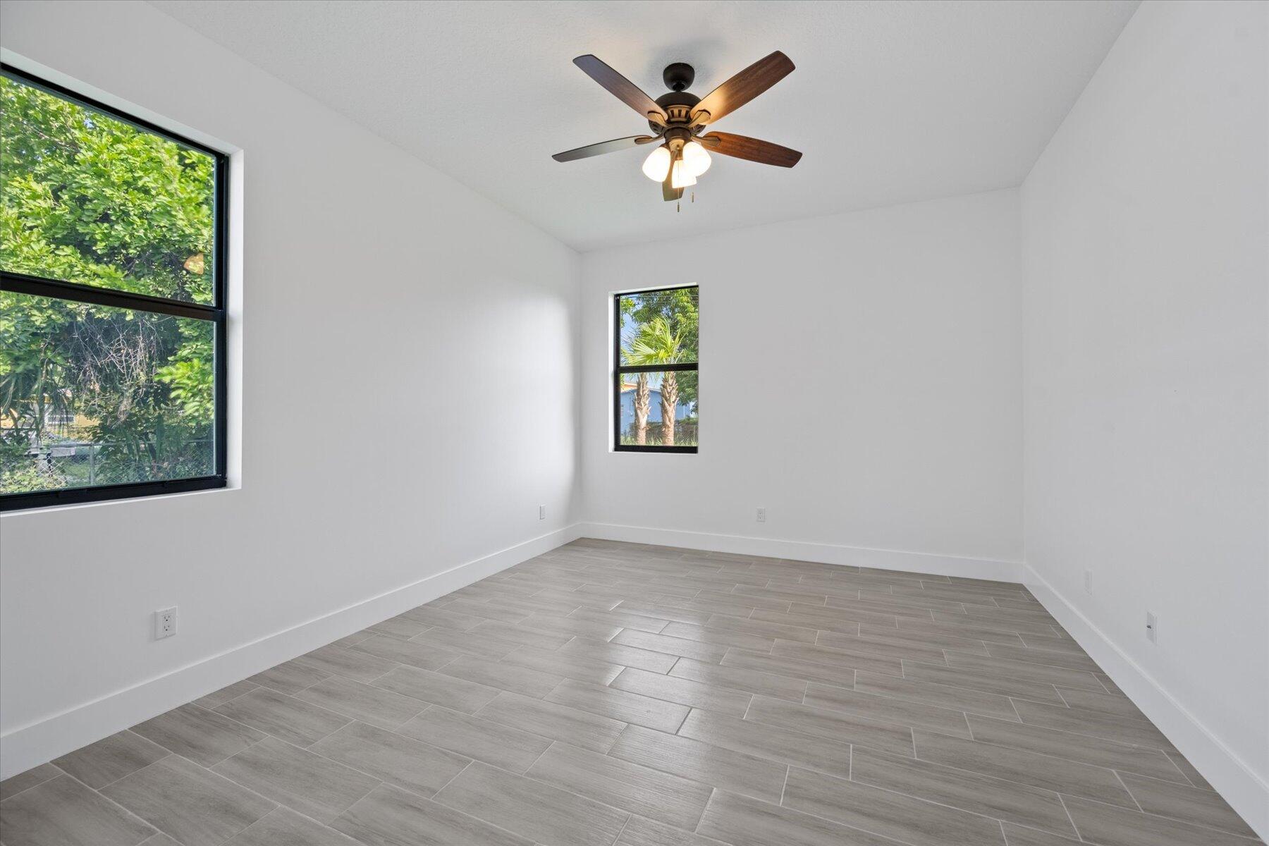 1491 West 30th Street Riviera Beach, FL 33404 - Photo 5 of 15 a view of empty room with wooden floor