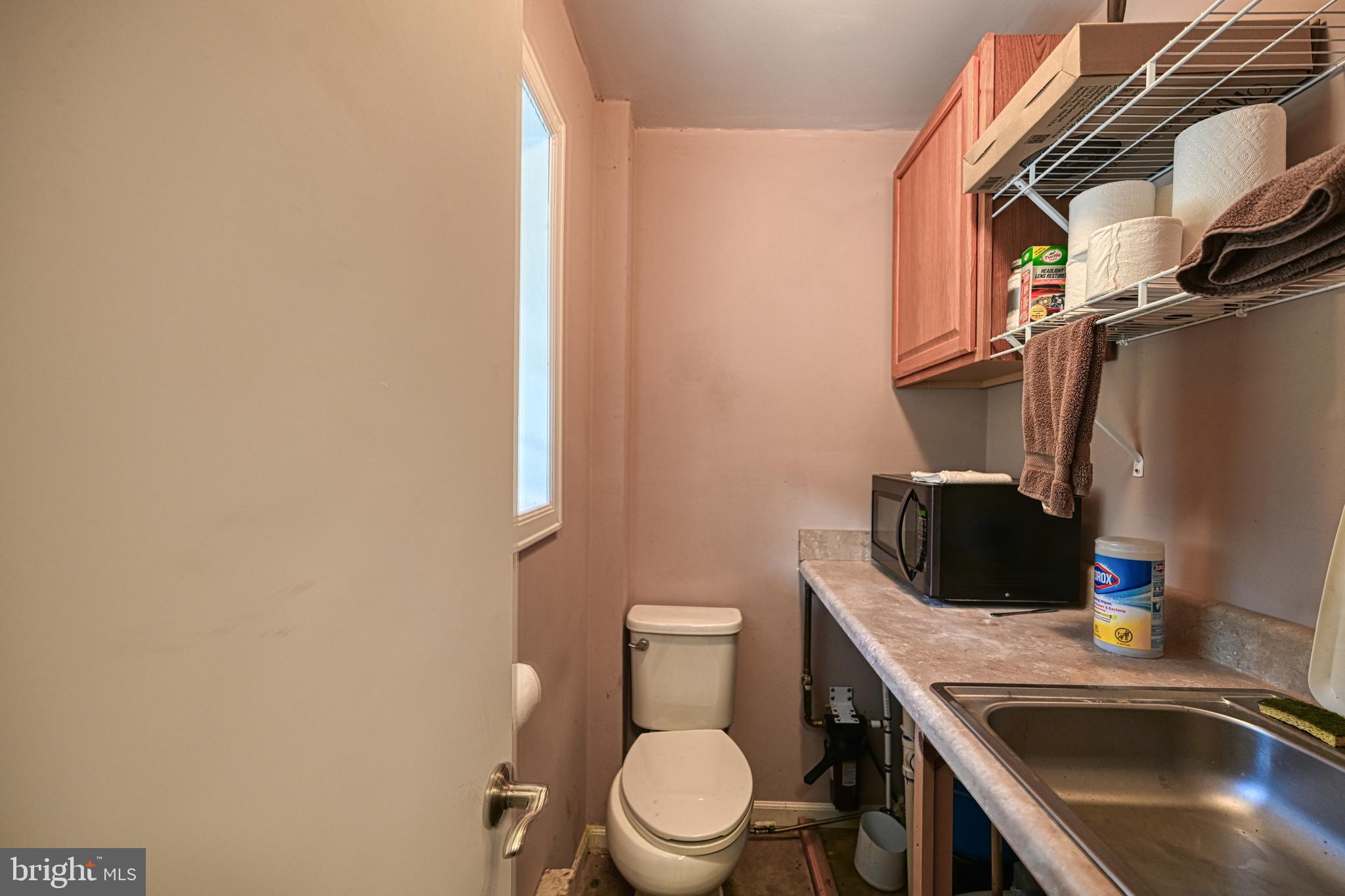 Cross Country Road Mineral, VA 23117 - Photo 53 of 58 a bathroom with a sink a toilet and mirror
