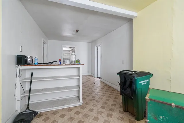 a kitchen with a refrigerator and cabinets
