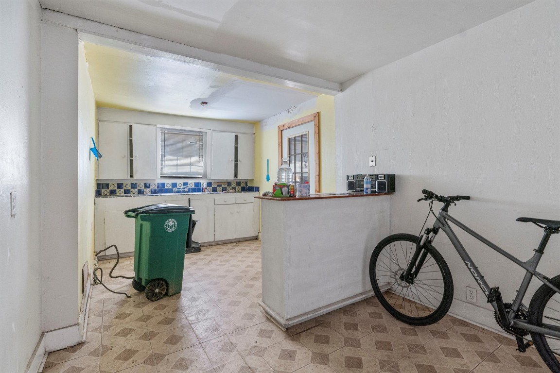 6311 Del Monte Road Austin, TX 78741 - Photo 10 of 24 a kitchen with white cabinets and white appliances