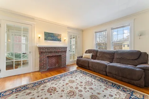 a living room with furniture and a rug