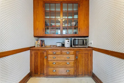 a bedroom with bed and window