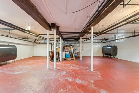 a view of a porch with wooden floor and fence