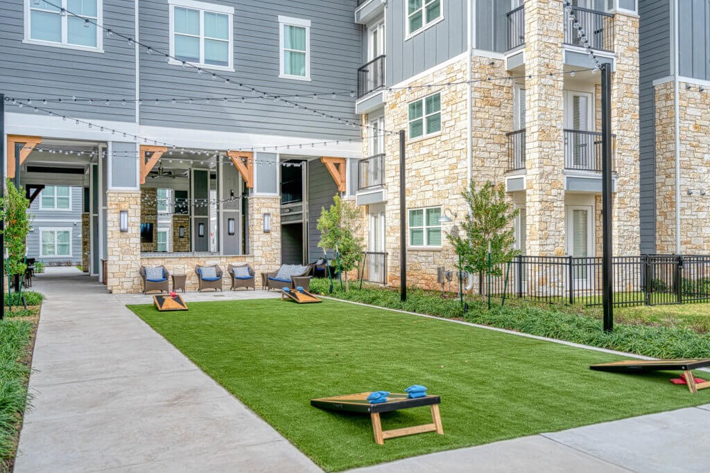 11250 Mason Road, Unit 4208 Cypress, TX 77433 - Photo 10 of 13 a view of a backyard with a garden and plants