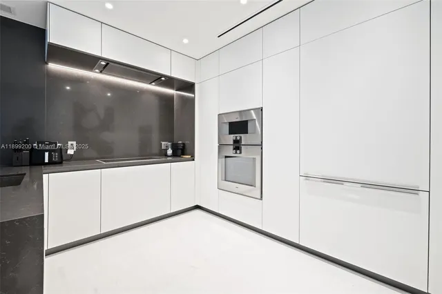 a bathroom with a shower and a sink