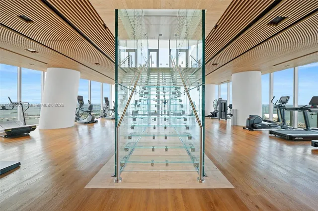 a view of an entryway with wooden floor