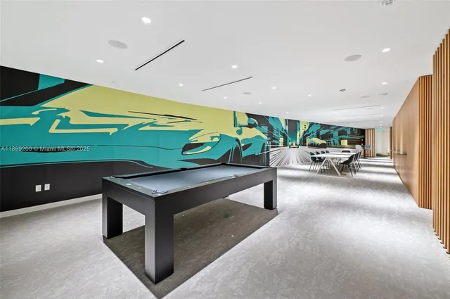 a lobby with furniture and a potted plant