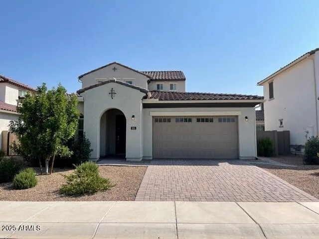 a front view of a house with a garage