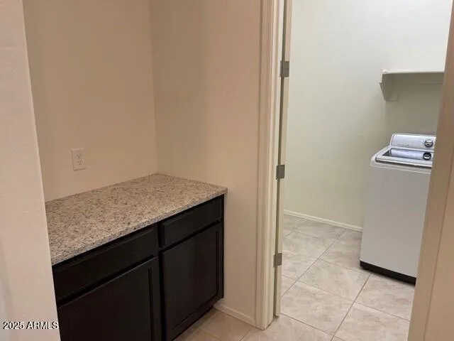 a kitchen with a sink and a refrigerator