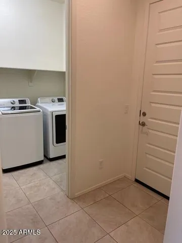 a view of a storage & utility room with washer and dryer