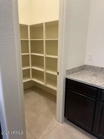 a kitchen with a stove and a cabinet