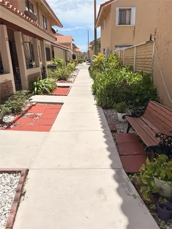 a view of a pathway with house on both side