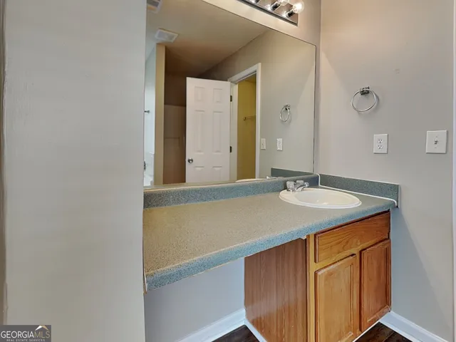 a bathroom with a sink and a mirror