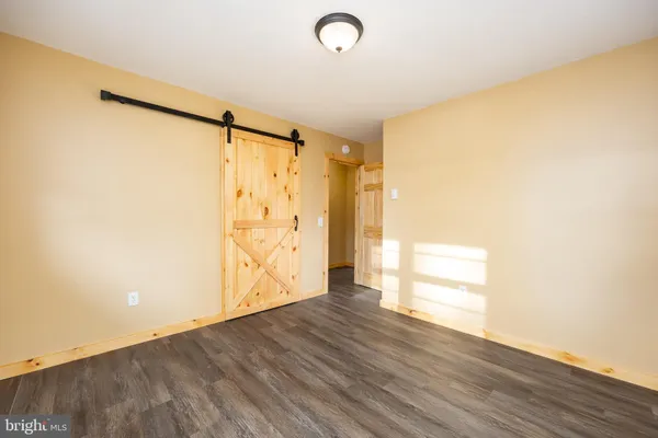 a view of a house with pool and sitting area