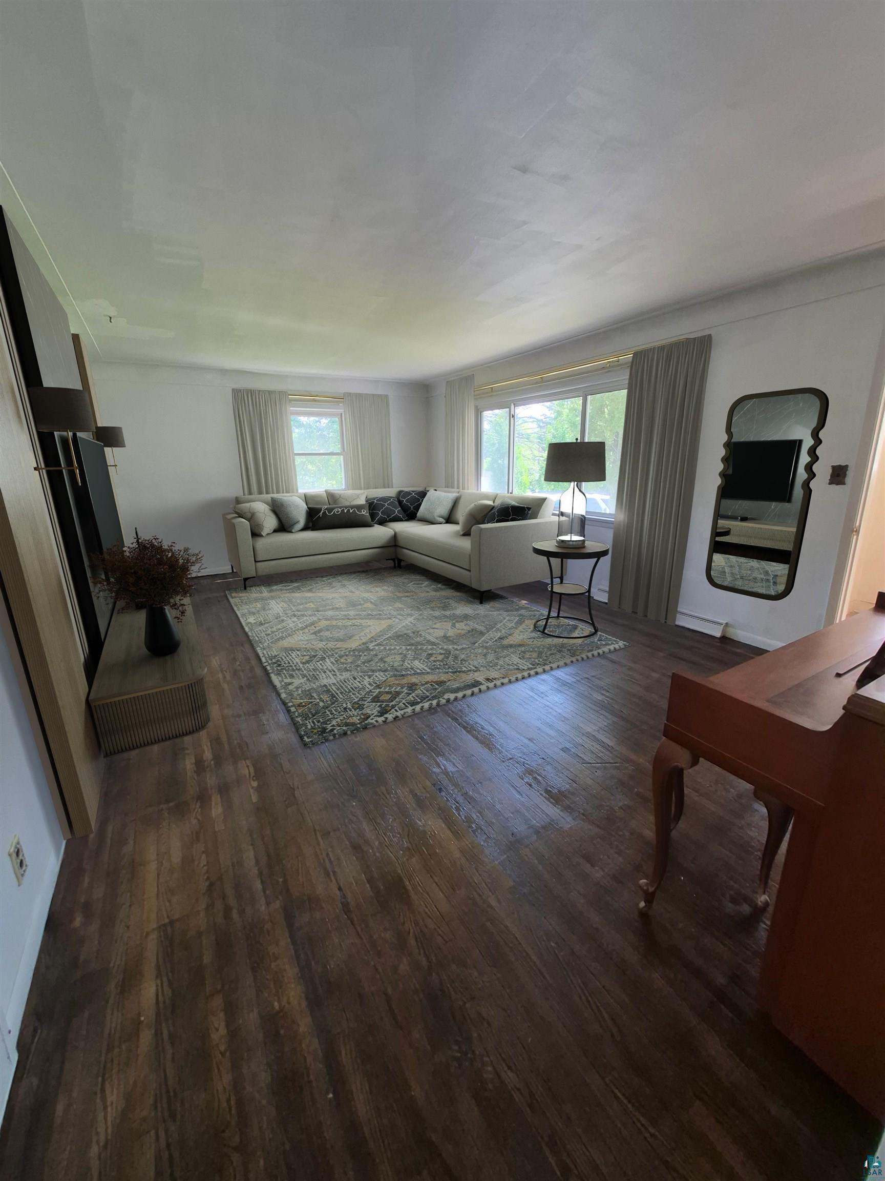 2109 West 22nd Street Duluth, MN 55811 - Photo 17 of 29 Spacious living area featuring wood-finish flooring, multiple windows, and crown molding