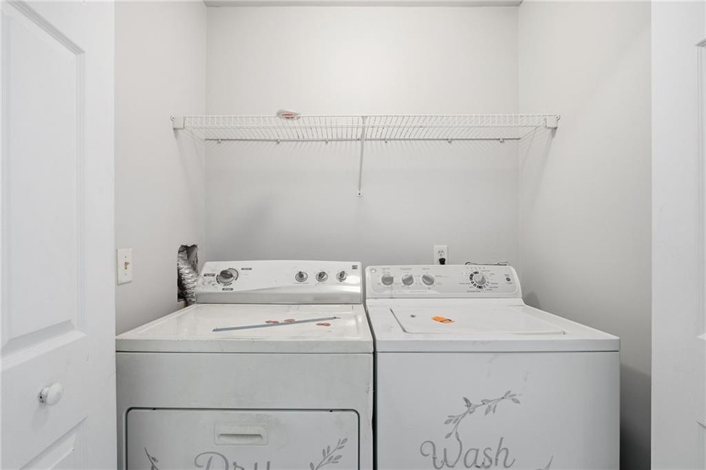 585 McWilliams Road Southeast, Unit 2402 Atlanta, GA 30315 - Photo 16 of 25 a utility room with dryer and washer