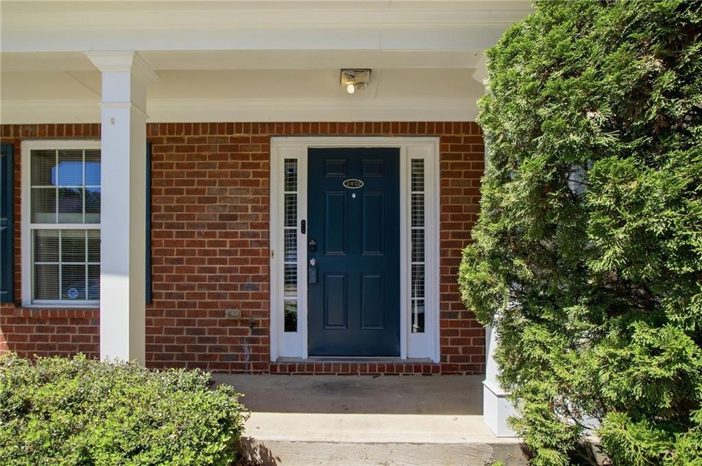 585 McWilliams Road Southeast, Unit 2402 Atlanta, GA 30315 - Photo 2 of 25 a front view of a house with a tree